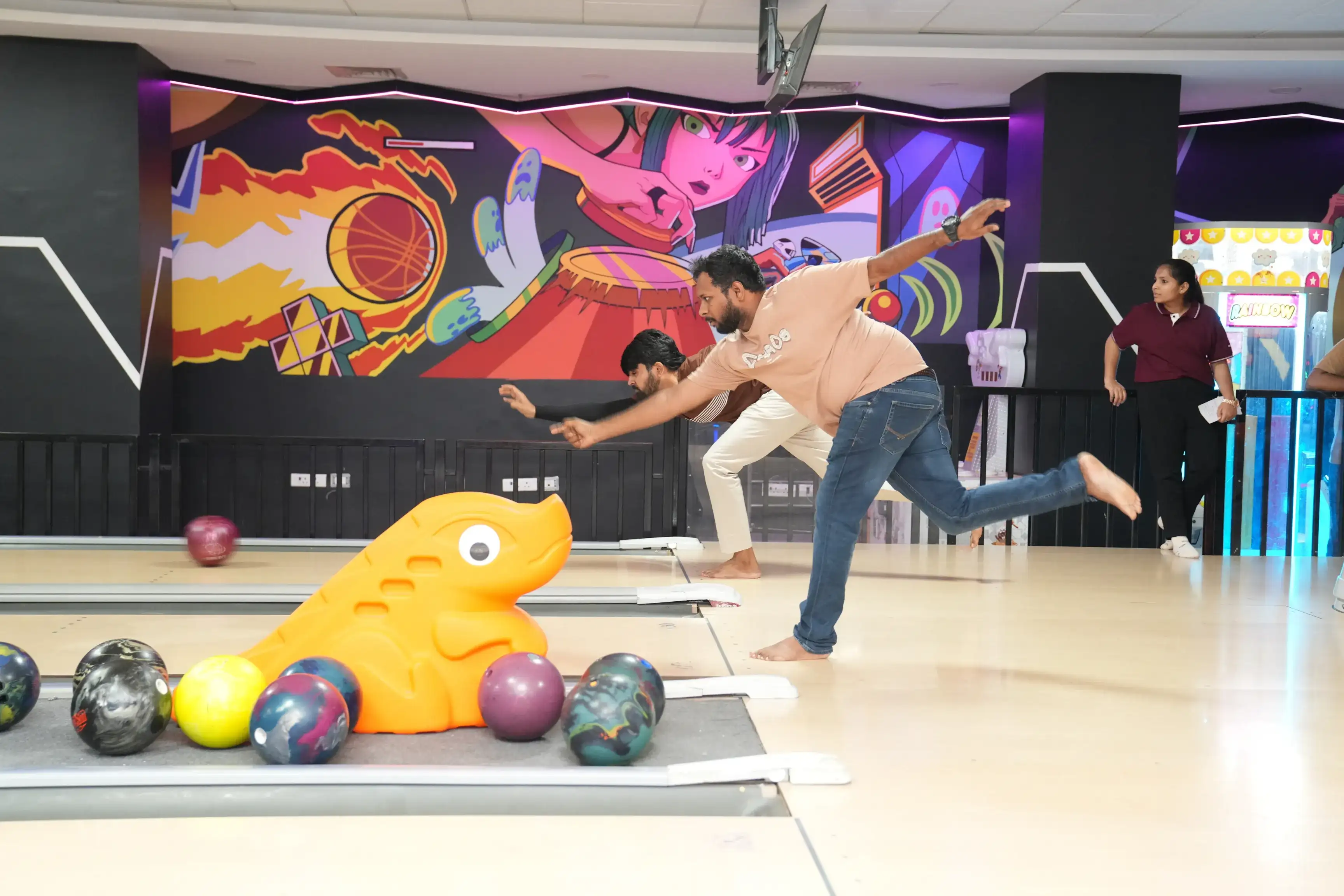 JP Morgan employees playing arcade games during the team outing